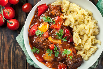 Hungarian beef goulash serwed with galuska noodles