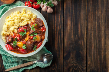 Hungarian beef goulash serwed with galuska noodles