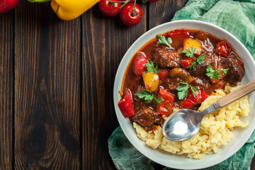 Hungarian beef goulash serwed with galuska noodles