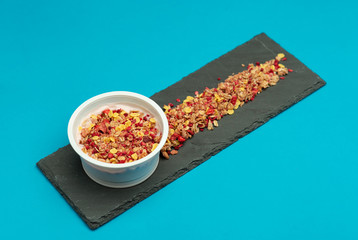 desserts yogurt and cereals, strawberry and raspberry. On blue background