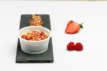 desserts yogurt and cereals, strawberry and raspberry. On white background