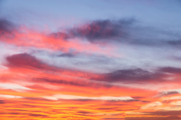 sunset sky with orange clouds on the city. Background wallpaper