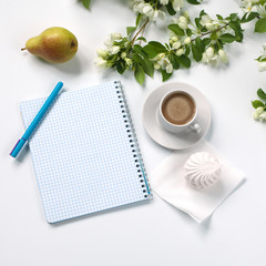 Summer composition of coffee and flowering greens. Accessories.
