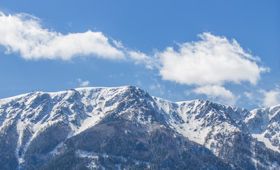 Fototapeta na wymiar snow tops of the mountain 