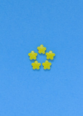 Abstract summer flower from yellow candy