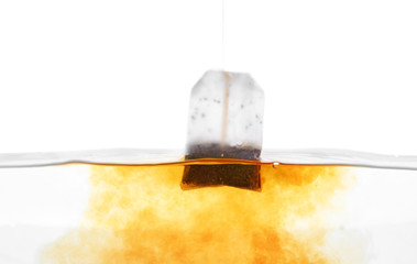 Brewing of hot beverage with tea bag, closeup