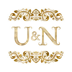 U and N vintage initials logo symbol. The letters are surrounded by ornamental elements. Wedding or business partners monogram in royal style.