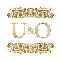 U and O vintage initials logo symbol. The letters are surrounded by ornamental elements. Wedding or business partners monogram in royal style.