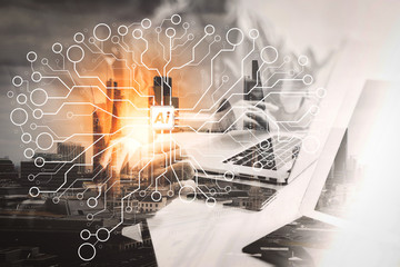 Double exposure of success businessman working in office with digital tablet laptop computer with London building and smart phone,filter effect