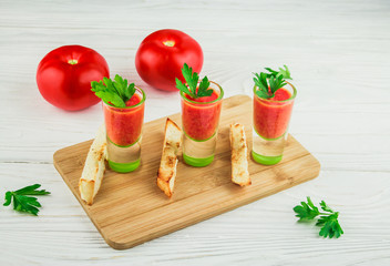 cold gazpacho soup on a wooden background