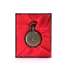 Pocket watch in box with red silk isolated on white background