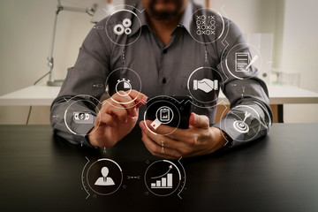 businessman working with smart phone and digital tablet and laptop computer in modern office