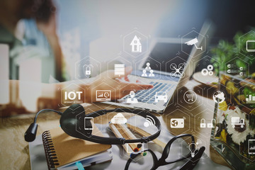 Man using VOIP headset with digital tablet computer docking smart keyboard, concept communication, it support, call center and customer service help desk,filter film effect