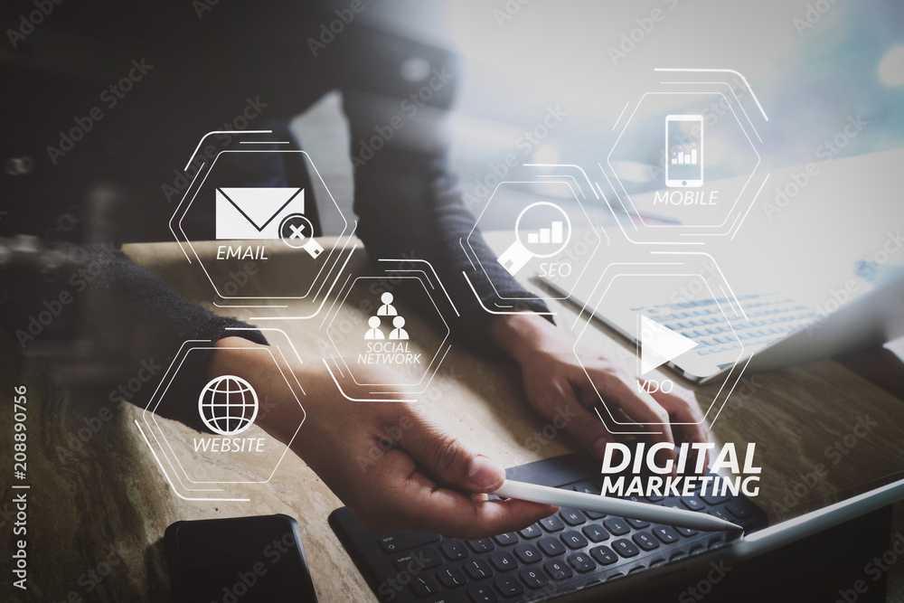 Aufkleber Website designer working digital tablet dock keyboard and computer laptop with smart phone and graphics design diagram on mable desk as concept