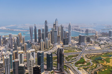 Fototapeta na wymiar Aerial view of modern skyscrapers and sea in the background, Dubai, UAE.