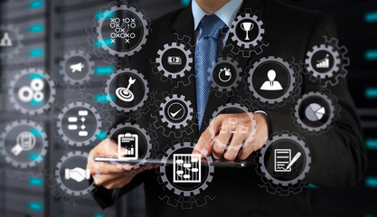 businessman  using tablet computer and server room background