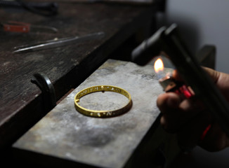 melting gold jewelry by gas.