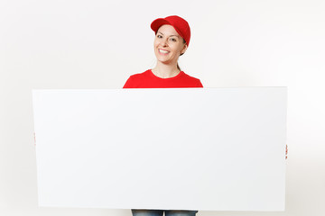 Delivery woman in red uniform isolated on white background. Female courier in cap, t-shirt, jeans holding big white empty billboard. Copy space advertisement. Place for text or image. Advertising area
