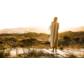 Naklejka premium Beautiful woman wrapped in a wool towel