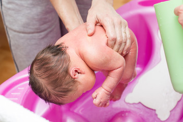 Fototapeta na wymiar Newborn bathing at home