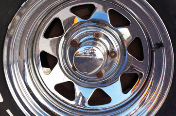 Chromed metal rim. Car alloy wheel.