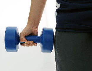 Fitness man is holding dumbell on isolated white background..