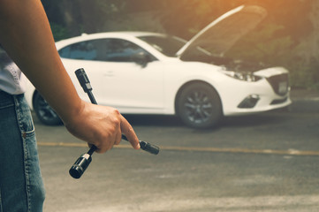 Close up wrench in my hands to repair the broken down car.