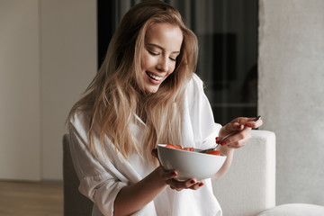 Healthy young woman dressed in white shirt