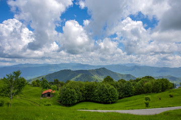 Isolated road in the countryside in spring time around Genoa (Genova) province, Italy.