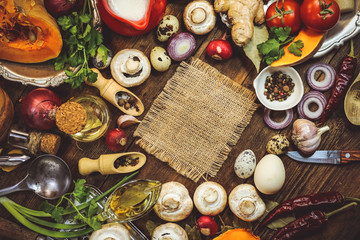 Fototapeta na wymiar food ingredients. mushrooms, vegetables, spices. place for text. wooden background.