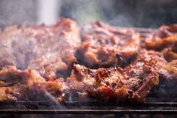 Grilled pork cutlets,on a charcoal grill.