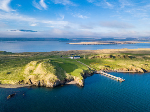 Iceland Reykjavik nature and small house on the island with pier. Top view. Aerial photo