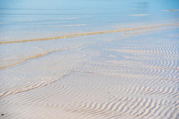 Beautiful white sand beach, clear wave water, white sand and sea nature sunshine time.Thailand.