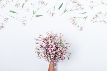 Woman's hand holding small bouquet