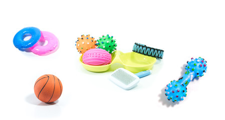 Pet accessories abot rubber toys, collars on isolated white background.