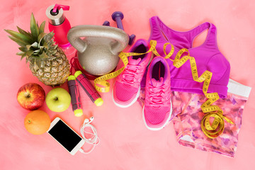 Workout equipment objects on pink floor