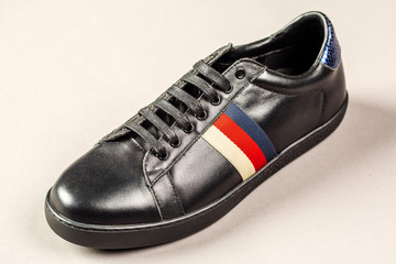 Black men shoes against gray background