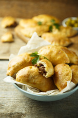 Homemade hand pies with minced meat and olives