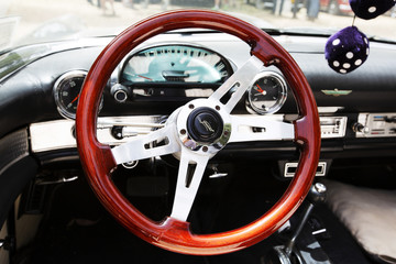 ISRAEL, PETAH TIQWA - MAY 14, 2016:  Exhibition of technical antiques. Steering wheel and dashboard in interior of  automobile in Petah Tiqwa, Israel