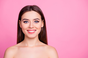 Close up beauty portrait of attractive cute charming gorgeous kind sincere joyful girl with flawless perfect skin ideal teeth and make up, with naked shoulders, isolated on pink background, copyspace