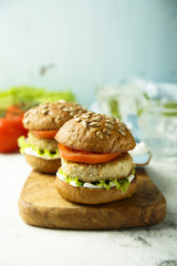 Homemade burgers with lettuce and tomato