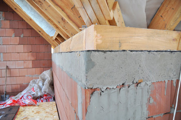 Close up on attic house construction with wooden beams, waterproof bitumen memmbrane,  trusses, logs, insulation interior.
