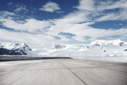 empty brick ground with sonw mountain as background