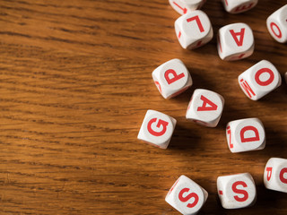 Letters dices on wooden table