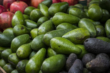 Background from environmentally friendly avocado without GMOs on the market in Tel Aviv in Israel. 