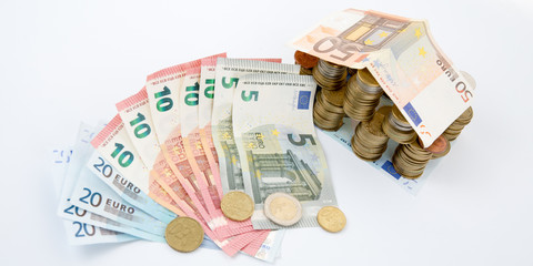 euro money household and financing concept home house made from Euro banknotes and coins