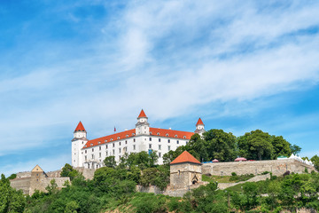 Naklejka premium Bratislava, Slovakia - May 24, 2018: View of Bratislava castle which occupies a prominent location in the city overlooking the Danube river. 