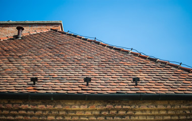Fototapeta premium Tiling roof and blue summer sky