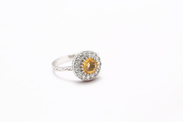 Yellow gem stone and diamond ring