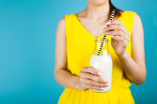 Woman holding a bottle of milk